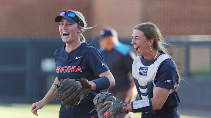 Reece Holbrook and Leah Boggs react on the field during the Virginia softball game against Louisville at Palmer Park.